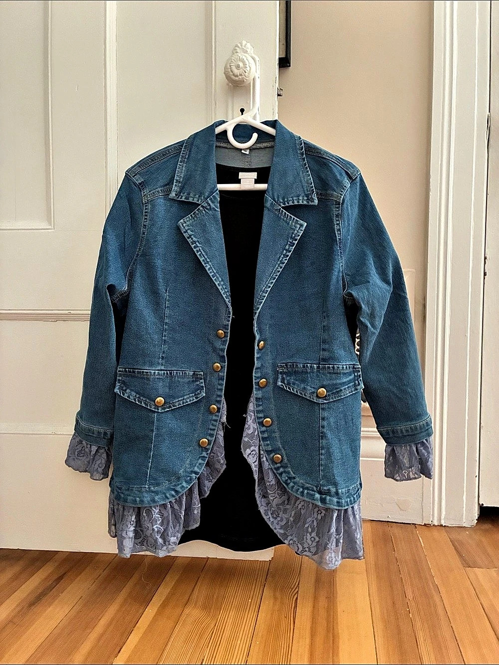 Women's Denim Jacket with Ruffle Hem size says small but it runs big
